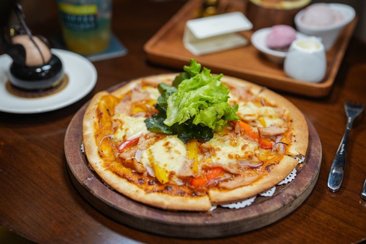 紐奧良披薩（220元）餡料鹹中帶甜，餅皮薄脆。田欣雲攝