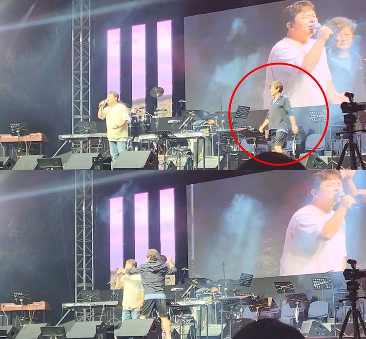 許閣演唱到一半，遭詭異男子（紅圈處）衝上舞台，搶走麥克風。翻攝YouTube